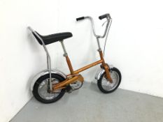 A RALEIGH BUDGIE 1969-1970 CHOPPER IN ORANGE FINISH AND CHROME MUD GUARDS AND HANDLE BARS