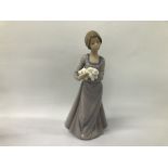 A NAO BY LLADRO PORCELAIN FIGURE OF A GIRL HOLDING WHITE RABBIT H 25CM