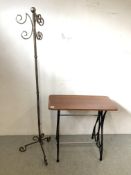 A DECORATIVE CAST IRON TABLE BASE (PROBABLY TREADLE) ALONG WITH METAL CRAFT COAT STAND