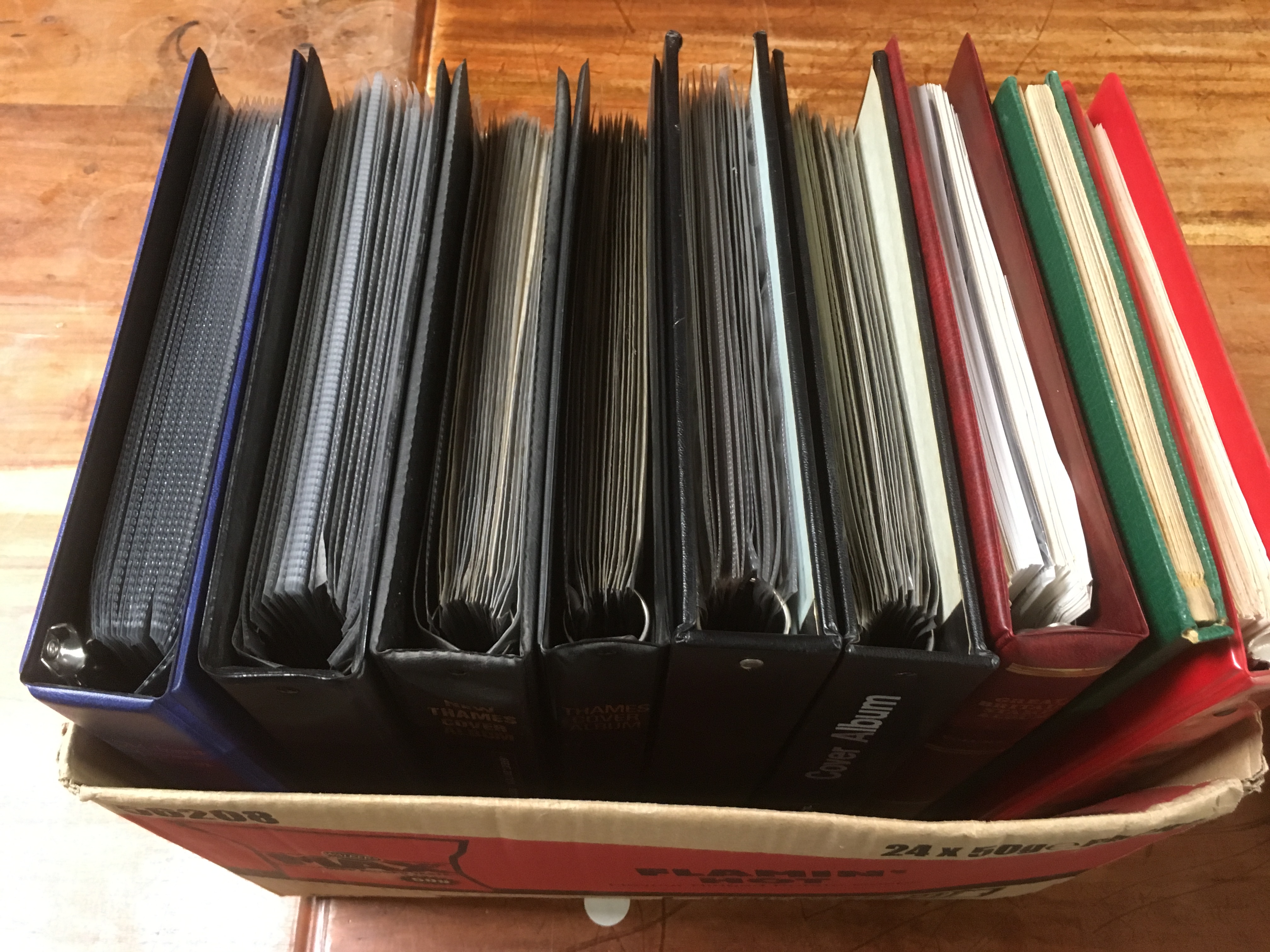 BOX WITH GB STAMPS AND FIRST DAY COVERS IN NINE ALBUMS