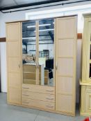 A LARGE MODERN BEECHWOOD FINISH COMBINATION WARDROBE,