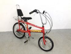 A RALEIGH CHOPPER MRK3 IN RED WITH CHROME HANDLE BARS AND MUD GUARDS