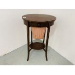 AN EDWARDIAN MAHOGANY TWO TIER WORK TABLE OF OVAL FORM ON SPLAYED LEG,