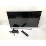 A SONY 32 INCH FLAT SCREEN SMART TV COMPLETE WITH REMOTE - SOLD AS SEEN