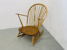 AN ERCOL BLONDE ROCKING CHAIR (BLUE LABEL)