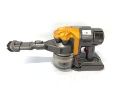 A DYSON DC16 HAND HELD BATTERY POWERED HOOVER COMPLETE WITH CHARGER - SOLD AS SEEN