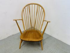 AN ERCOL BLONDE ARMCHAIR (BLUE LABEL)