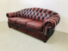 AN OXBLOOD BUTTON BACK CHESTERFIELD STYLE SOFA - L 200CM. D 95CM. H 82CM.