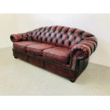 AN OXBLOOD BUTTON BACK CHESTERFIELD STYLE SOFA - L 200CM. D 95CM. H 82CM.