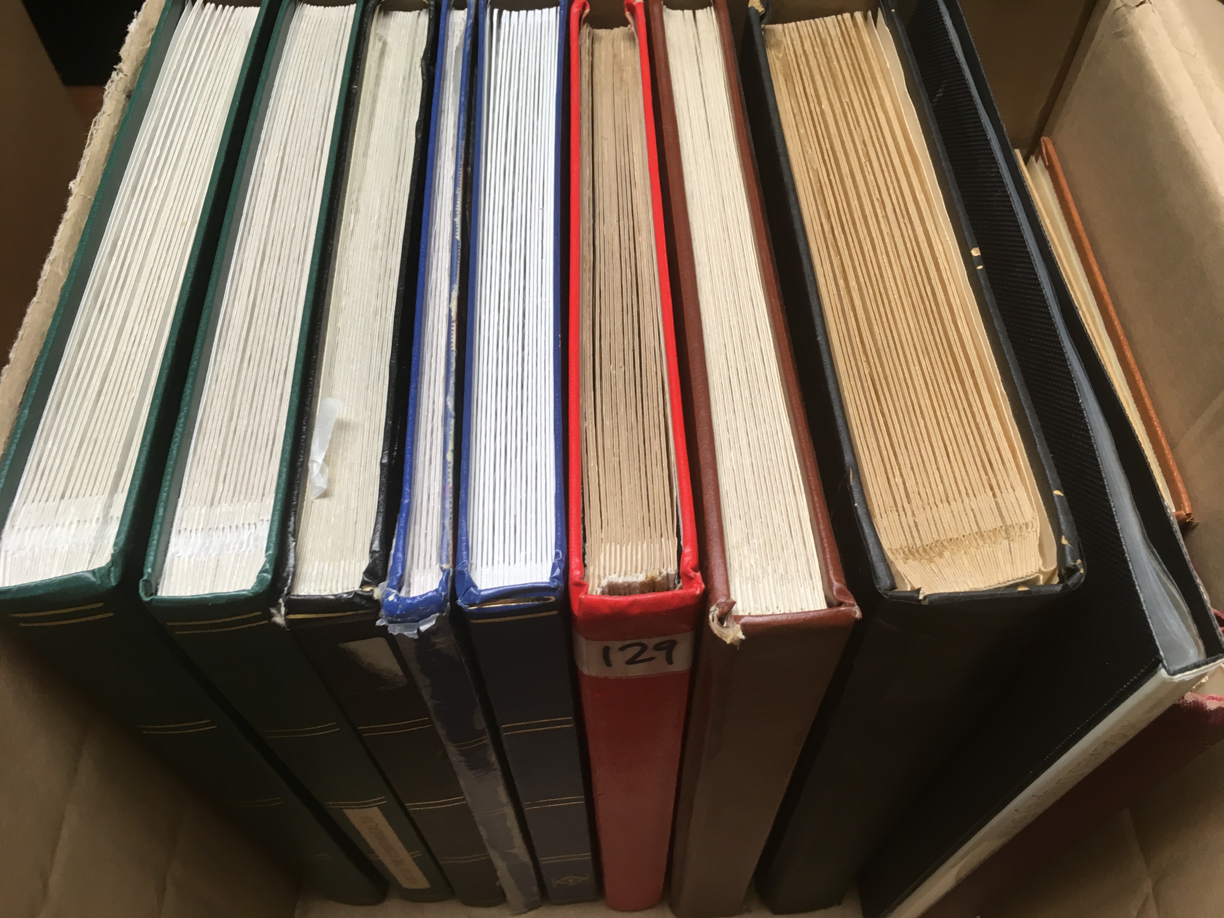 BOX OF VARIOUS IN TEN STOCKBOOKS AND AN