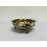 A VICTORIAN CIRCULAR SILVER TRIPOD BOWL, DECORATED WITH ROSES AND LIONS' HEADS.
