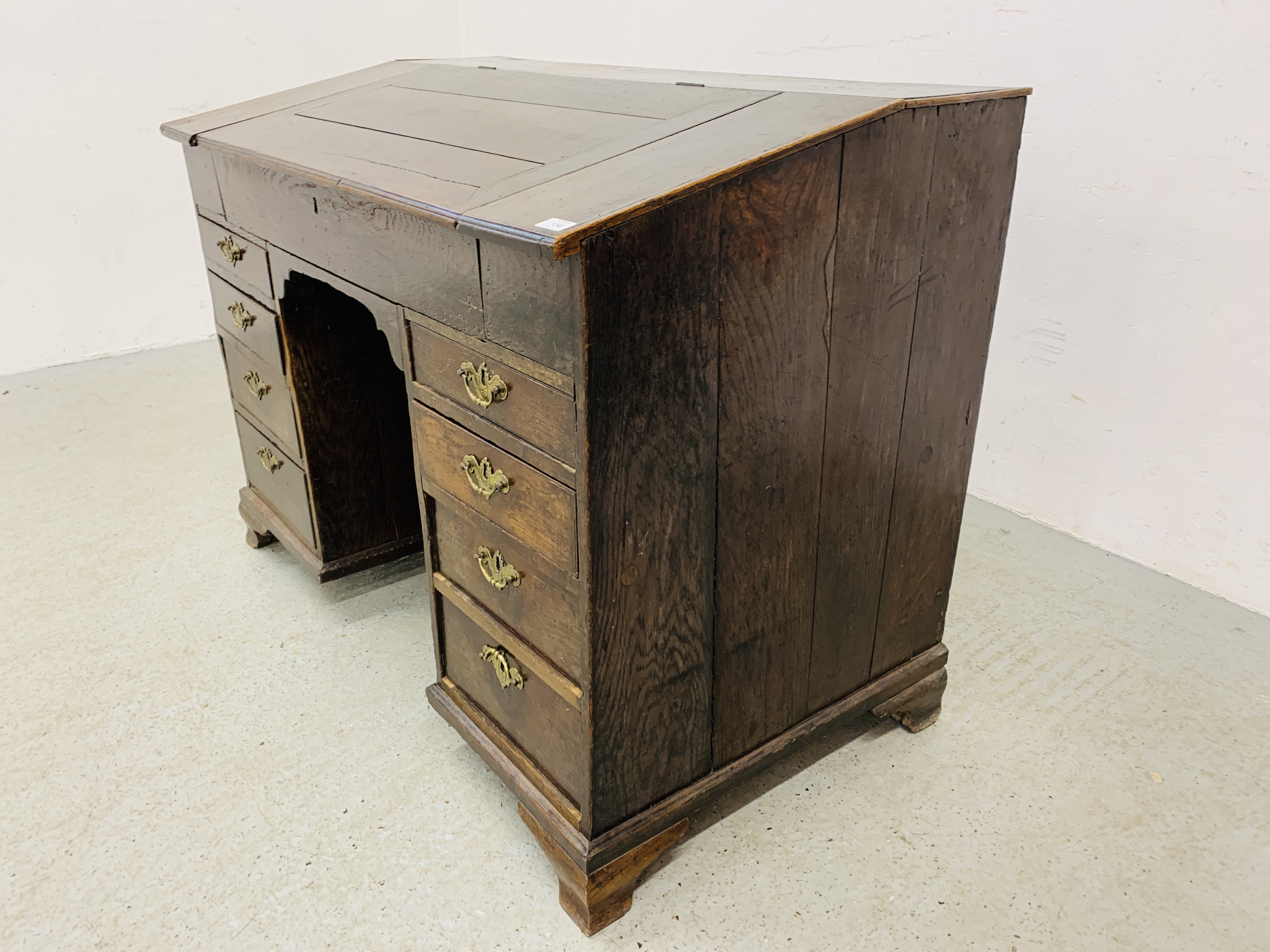 AN C18TH OAK SLOPED TOP KNEEHOLE DESK WITH FITTED INTERIOR AND EIGHT DRAWERS - D 120CM. W 68CM. - Image 4 of 15