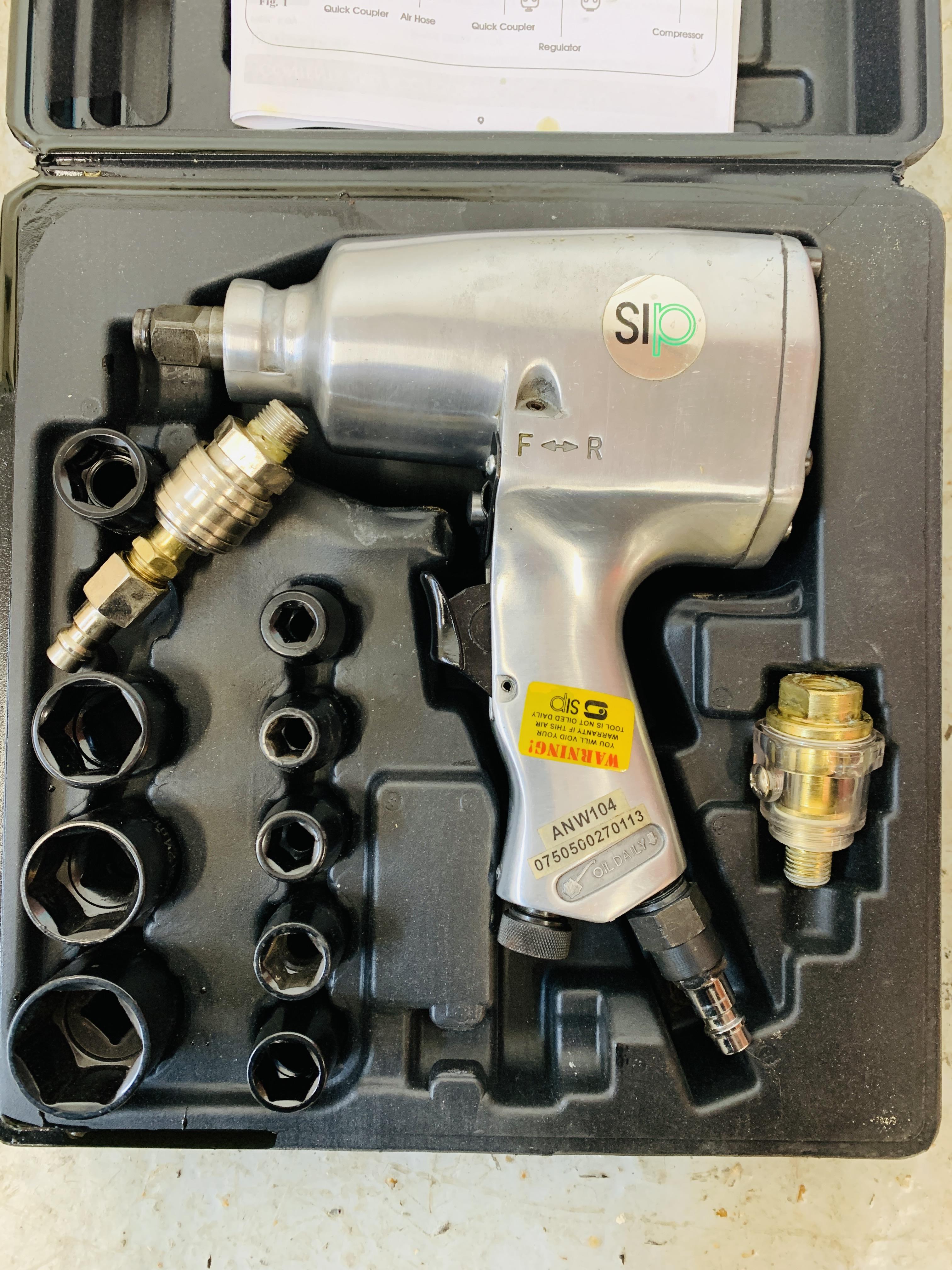 A CASED SIP ½ INCH AIR IMPACT WRENCH WITH INSTRUCTIONS AND ACCESSORIES ALONG WITH A COMPACT DIGITAL - Image 2 of 4