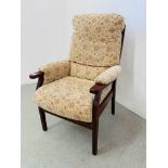 A HIGH SEAT UPHOLSTERED EASY CHAIR