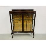 VINTAGE MAHOGANY GLAZED TWO DOOR DISPLAY CABINET ON BALL & CLAW FEET, GLASS SHELVES - W 105CM.