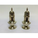 A PAIR OF SILVER CIRCULAR PEPPERS OF BALUSTER FORM, BY CHARLES HARRIS,