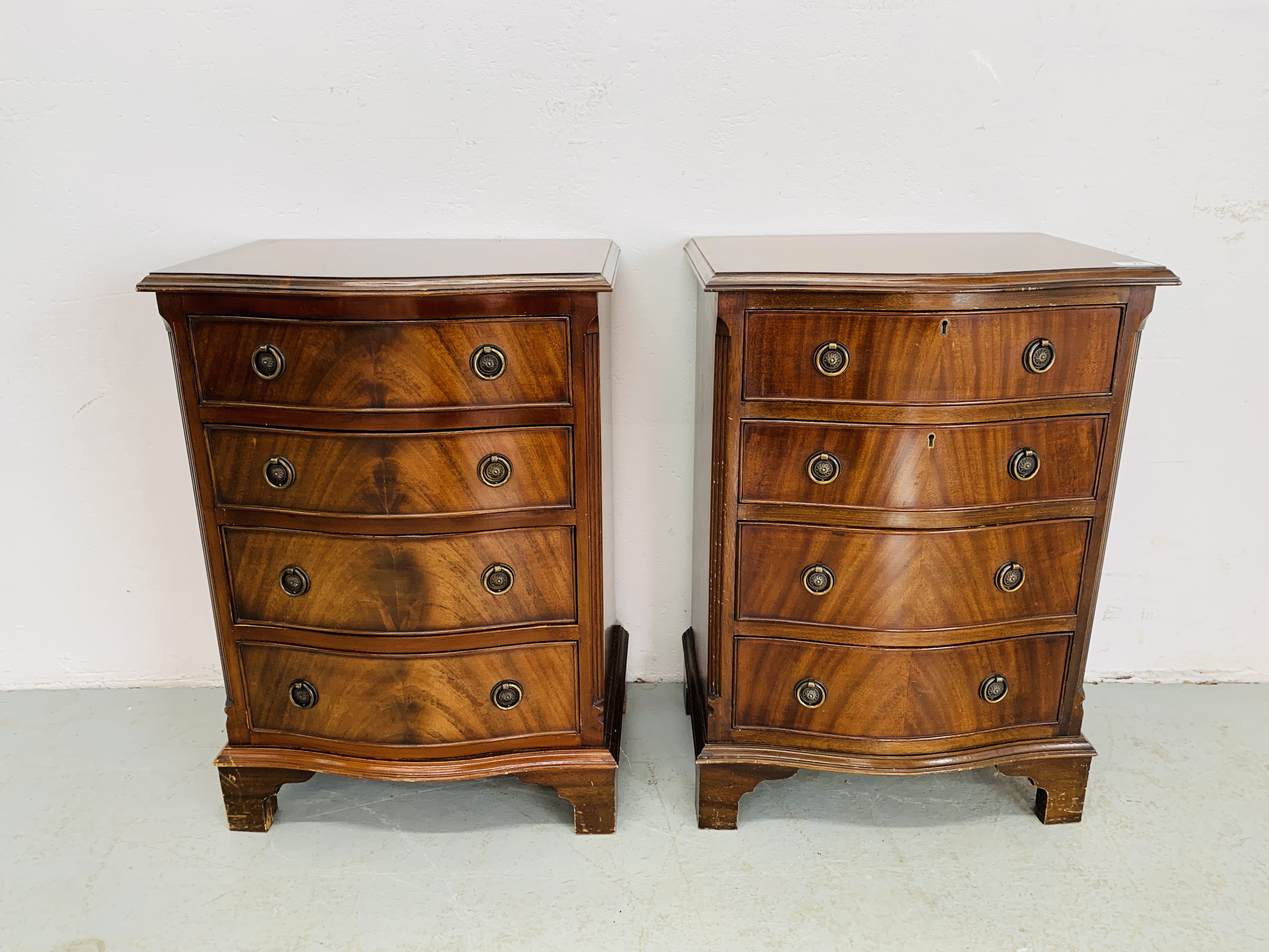 PAIR OF FLAME MAHOGANY FOUR DRAWER CHESTS - W 49CM. D 36CM. H 70CM.