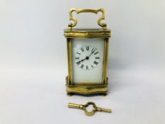 A BRASS CASED MANTEL CLOCK, ENAMELLED DIAL,