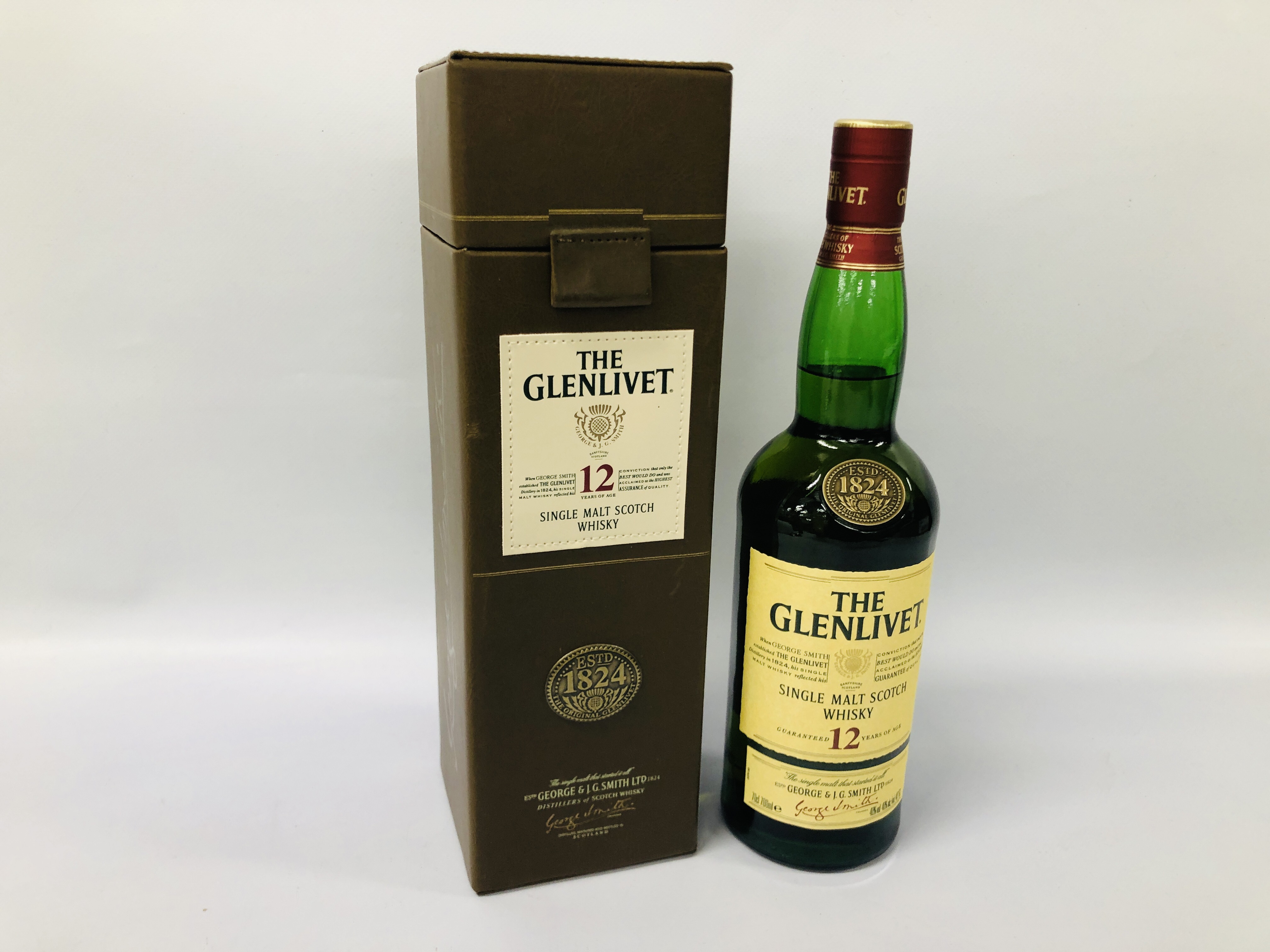 A 700ML BOTTLE OF "THE GLEN LIVET" 12 YEAR OLD SINGLE MALT WHISKY IN PRESENTATION BOX