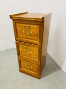 A SMALL WOODEN THREE DRAWER FILING CABINET - W 42CM. D 45CM. H 102CM.