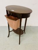 AN EDWARDIAN MAHOGANY TWO TIER WORK TABLE OF OVAL FORM ON SPLAYED LEG,