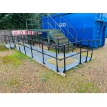 A SECTIONAL GALVANISED STEEL FRAME DISABILITY ACCESS RAMP COMPLETE WITH HANDRAILS AND ADJUSTABLE