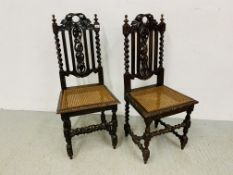 PAIR OF HEAVILY CARVED OAK HALL CHAIRS WITH RATTAN SEATS