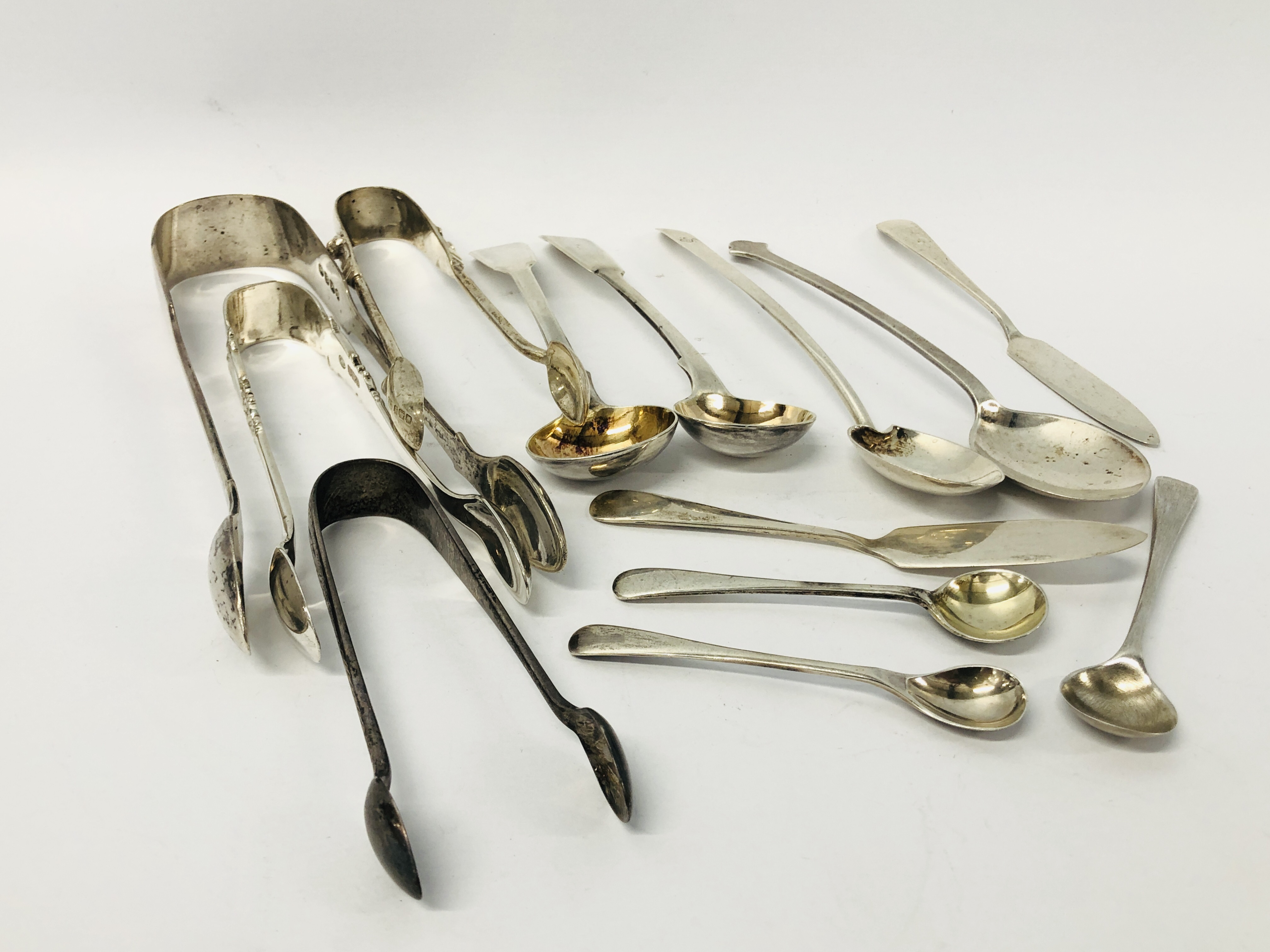 FOUR VARIOUS PAIRS OF SILVER SUGAR NIPS, FIVE SILVER SALT SPOONS,