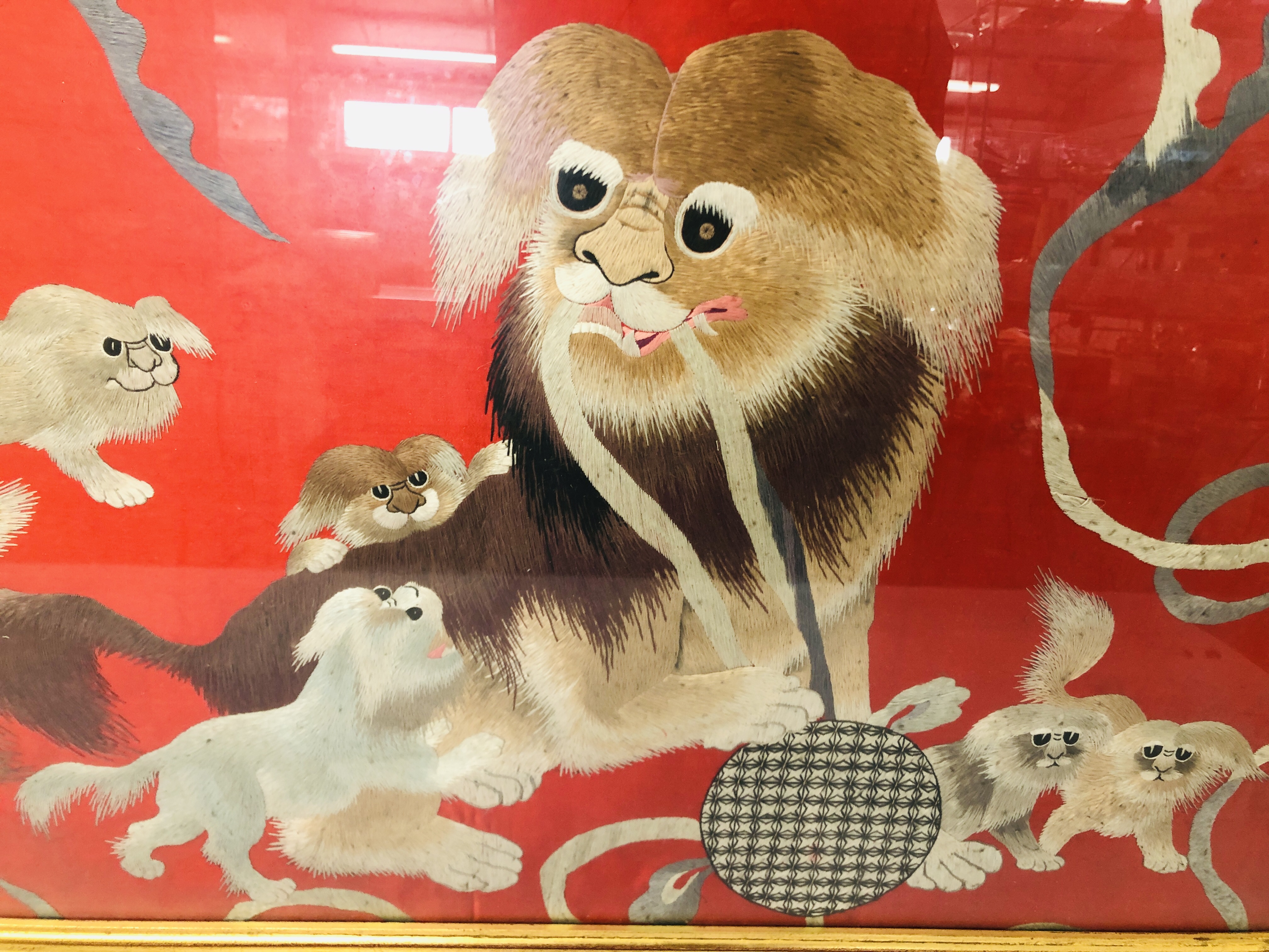 AN EARLY C20TH FRAMED PEKING SILK EMBROIDERY OF "SHORT DOGS" ON A RED BACKGROUND - H 50CM. W 80CM. - Image 3 of 3