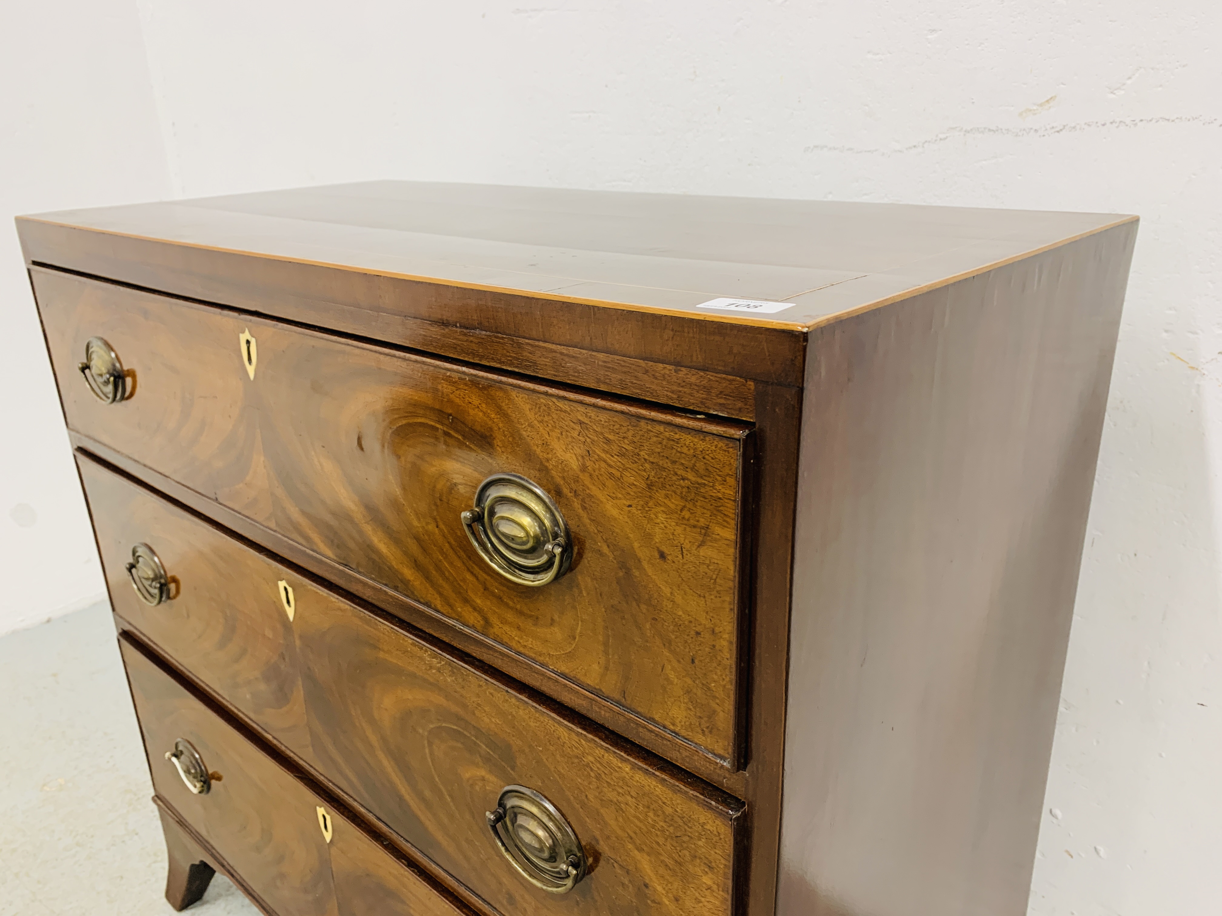 AN EARLY C19TH VINTAGE FLAME MAHOGANY 3 DRAWER CHEST, OVAL BRASS HANDLES ON SPLAYED LEGS - W 89CM. - Image 4 of 10