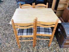 A KITCHEN TABLE AND FOUR PINE CHAIRS,