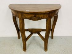 DESIGNER HARDWOOD HALF MOON HALL TABLE WITH CARVED DETAIL ON A STRETCHER STYLE BASE - W 83CM.