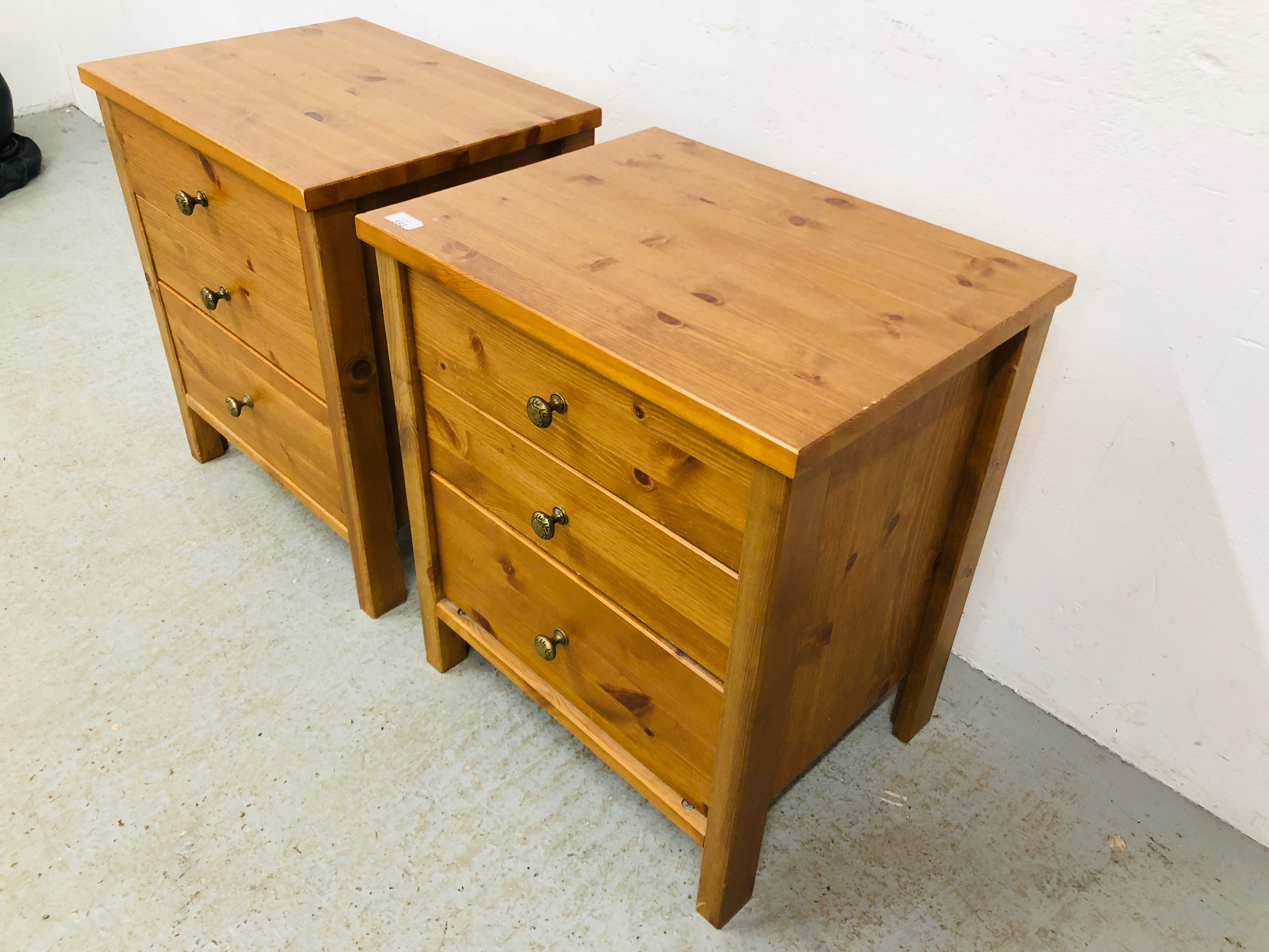 A PAIR OF HONEY PINE THREE DRAWER BEDSIDE CHESTS - W 53CM. D 41CM. H 61CM. - Image 2 of 5