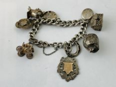 SILVER CHARM BRACELET TO INCLUDE 6 SILVER CHARMS AND 3 WHITE METAL CHARMS