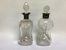 2 SIMILAR SILVER DECANTERS OF WAISTED FORM, WITH SILVER COLLARS,