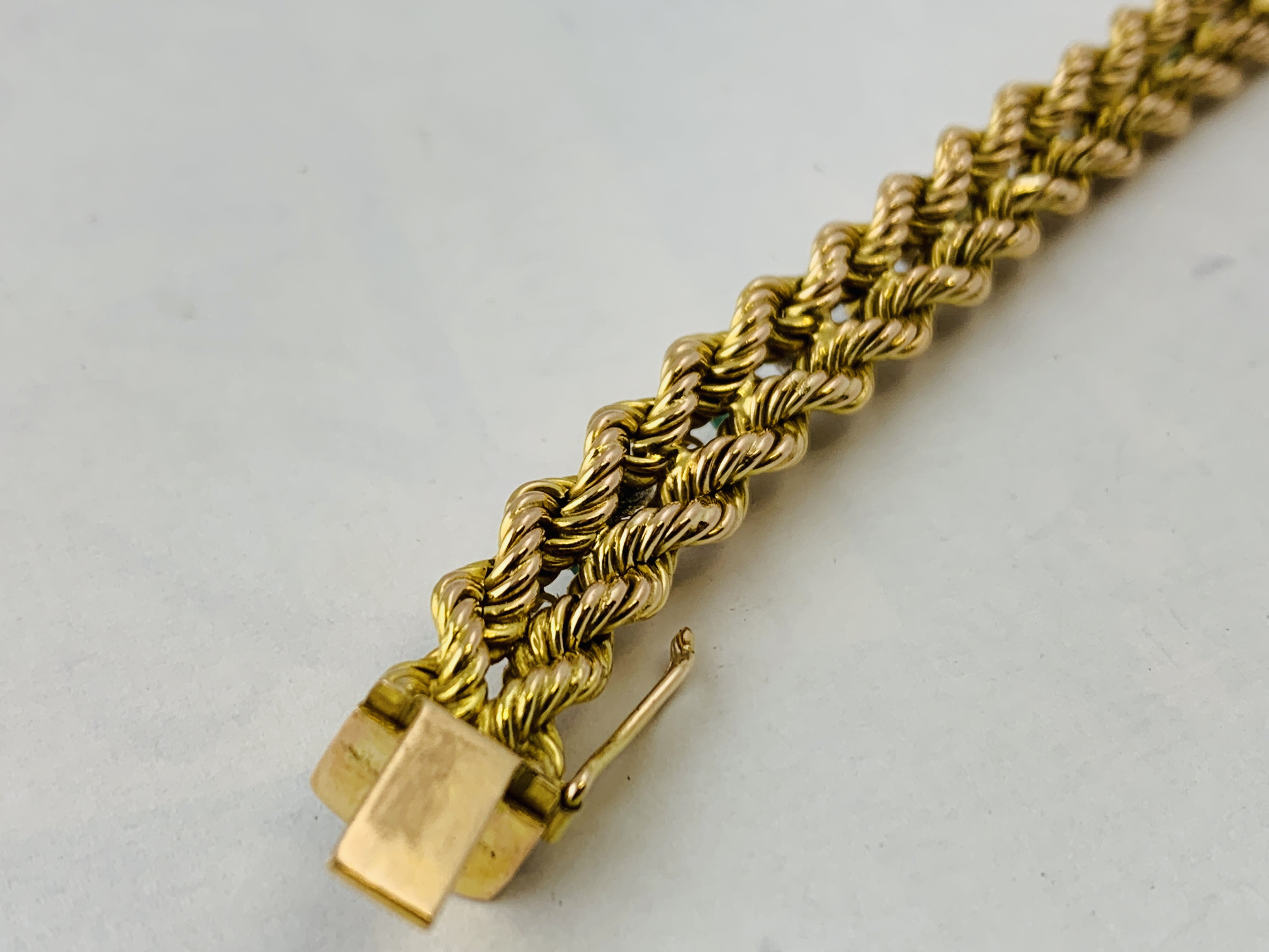 A BRAIDED DIAMOND AND EMERALD BRACELET MARKED 14K, - Image 6 of 7