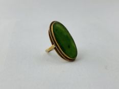 A 9CT GOLD DRESS RING SET WITH LOZENGE SHAPE JADE PANEL