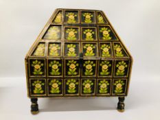 AN UNUSUAL WOODEN CASKET WITH HIPPED TOP AND HAND DECORATED FINISH (FOOT REPAIRED)