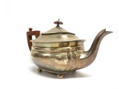 A SILVER TEAPOT,