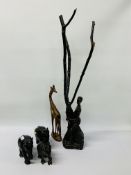 A FAMILY OF THREE EBONY CARVED ELEPHANTS (THE LARGEST STANDING 15CM),