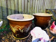 A PAIR OF LARGE BROWN GLAZED GARDEN PLANTERS WITH STANDS DIAMETER 50CM,