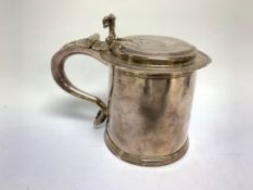 A WILLIAM AND MARY SILVER TANKARD, A DOMED LID, ENGRAVED WITH A LADY'S ARMORIAL, PROBABLY BY B.