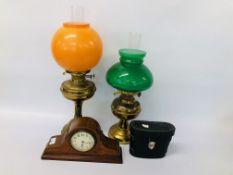 2 VINTAGE BRASS OIL LAMPS, ONE HAVING ORANGE GLASS SHADE, THE OTHER GREEN,