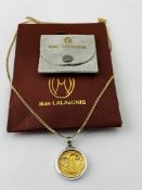 ILIAS LALAOUNIS 18CT GOLD PENDANT WITH CORNUCOPIA DESIGN IN SILVER MOUNT STRUNG FROM 9CT GOLD