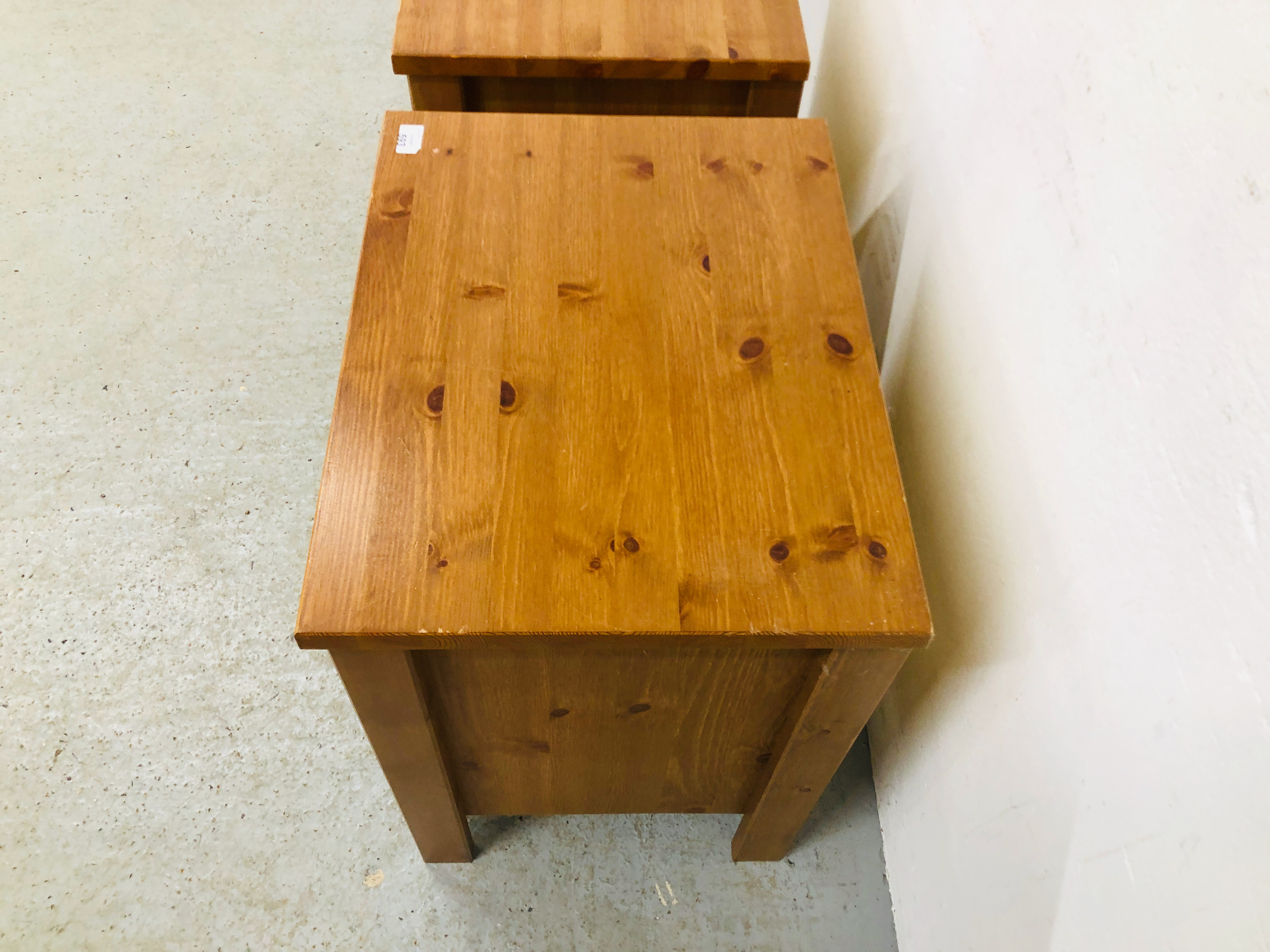 A PAIR OF HONEY PINE THREE DRAWER BEDSIDE CHESTS - W 53CM. D 41CM. H 61CM. - Image 3 of 5
