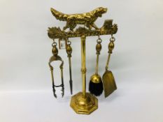 A BRASS FIRE IRON COMPANION SET,