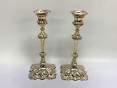 A PAIR OF SILVER PLATED CANDLESTICKS OF MID-C18TH DESIGN, 25.