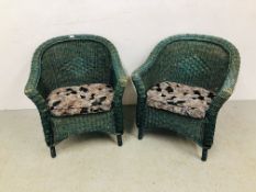 A PAIR OF GREEN WICKER ROLL ARMCHAIRS