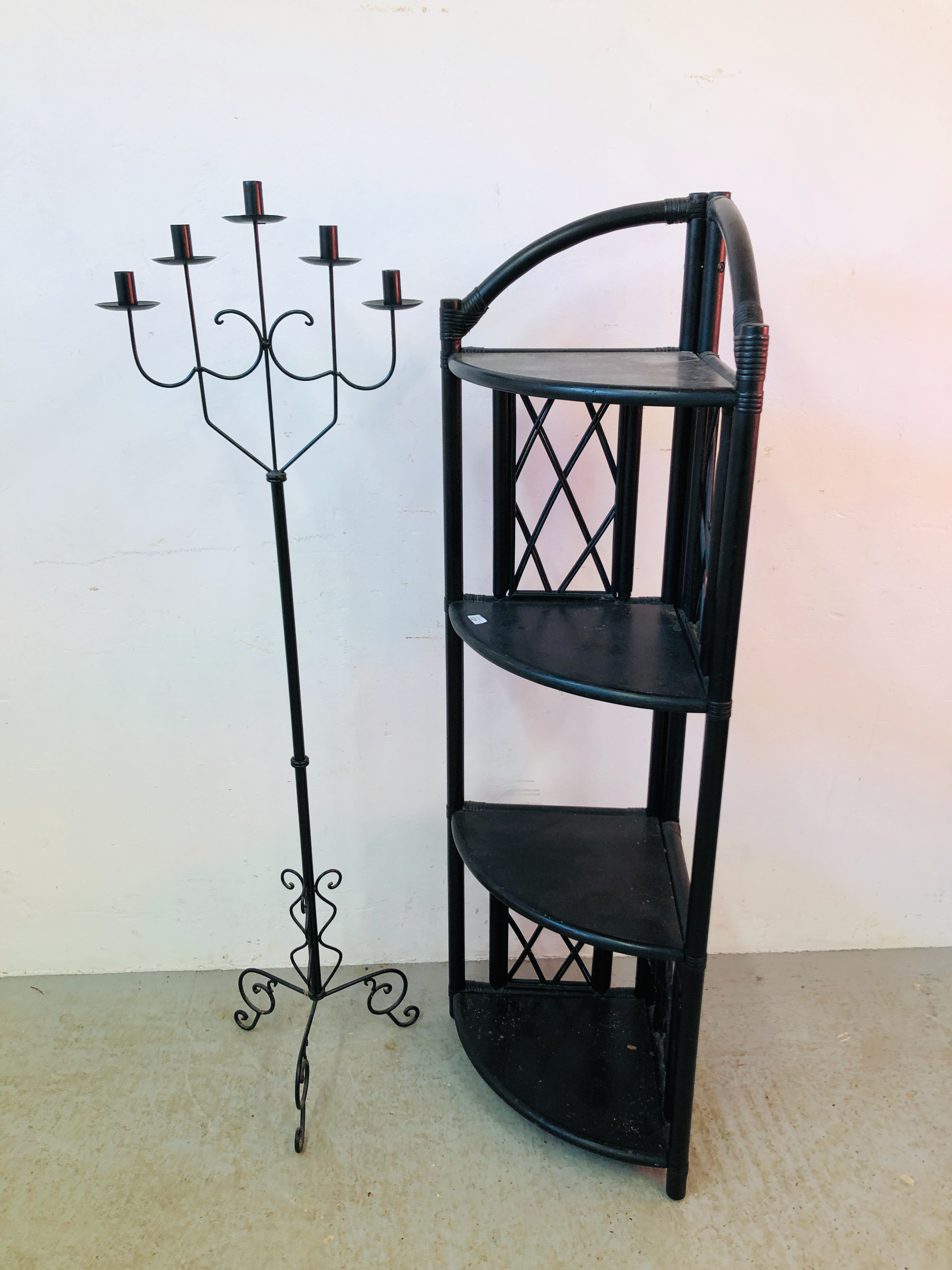 A CANE WORK FOUR TIER CORNER STAND AND A METAL CRAFT FLOOR STANDING CANDELABRA