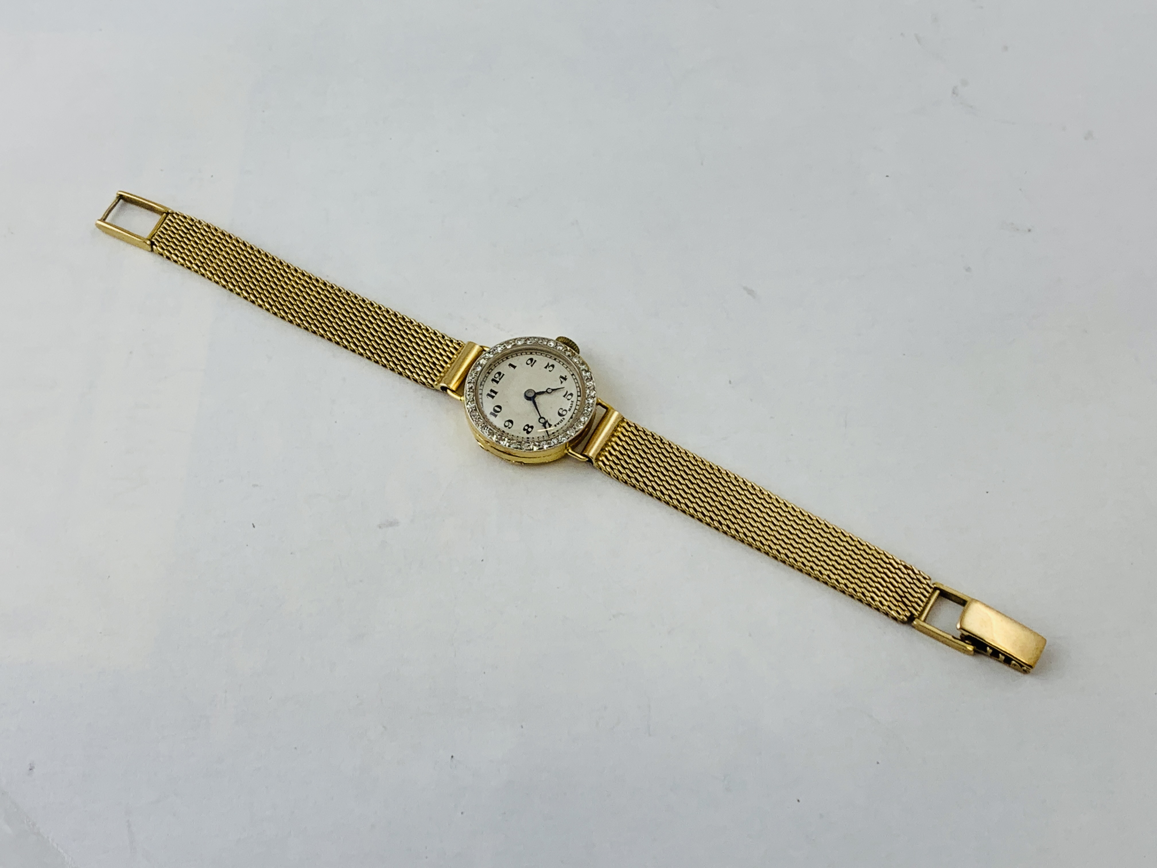 LADIES 18CT GOLD CASED WRIST WATCH ON 9CT GOLD BRAIDED STRAP THE BEZEL SET WITH 36 DIAMONDS THE